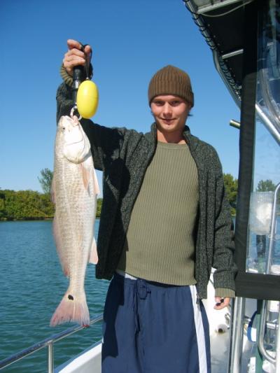 Ben Jordan with a 27+ inch redfish he released after a quick photo